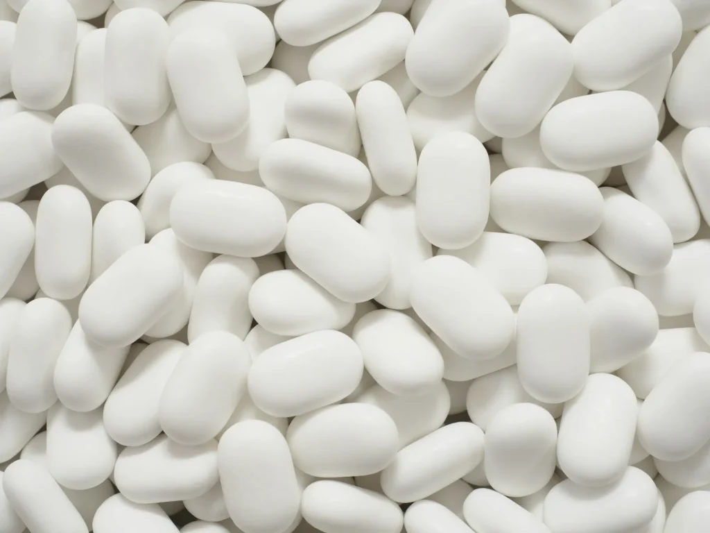 White oval tablets filling the frame